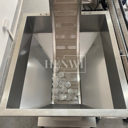 Henwi HWCM-W4x2 Automatic 2 Stations 4 Wheels Capper Bottle Screwing Capping Sealing Machine Cover Sealer with Automatic Cap Lifting Elevator Feeding Machine