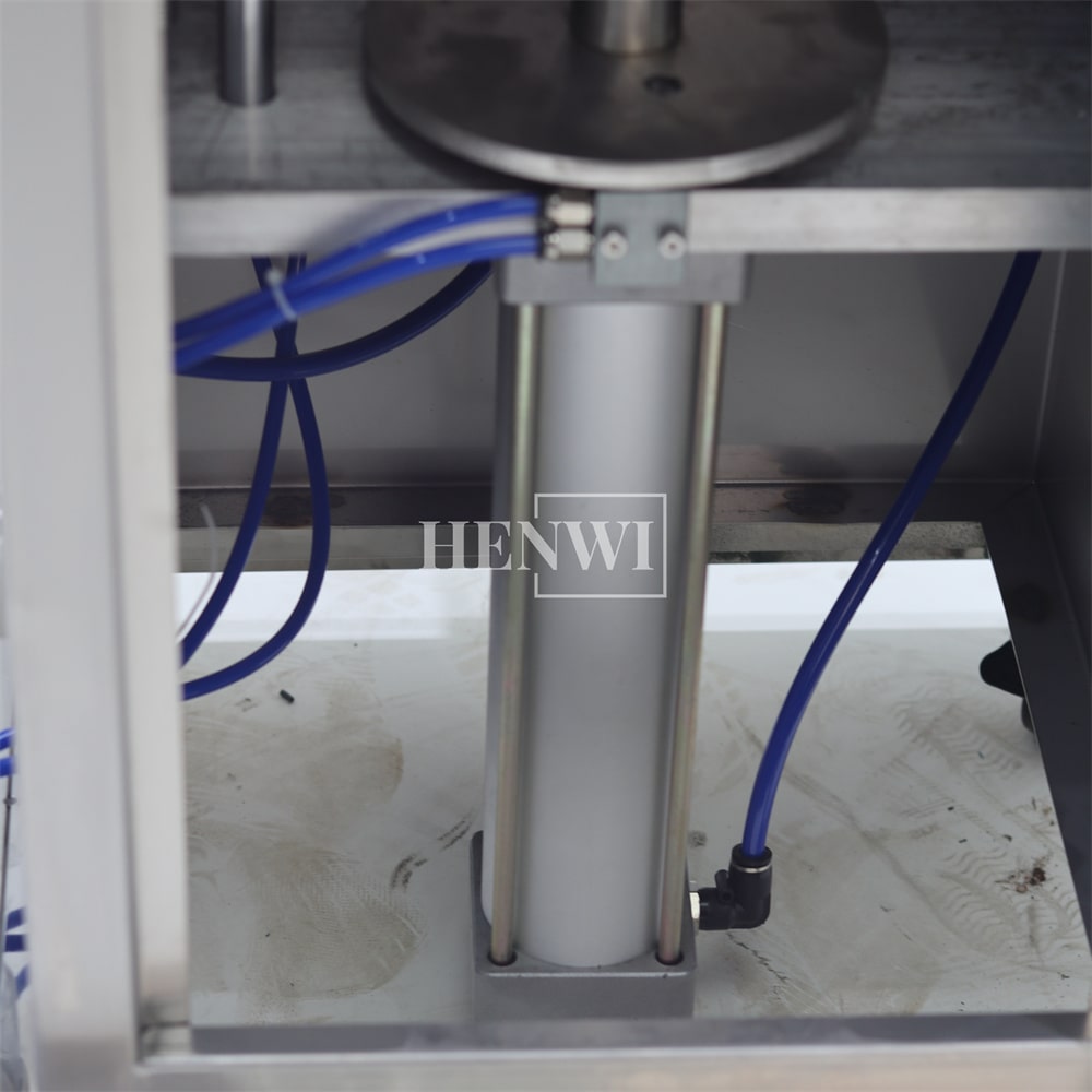 Henwi HWFM-S-VPF 1 Nozzle Semi-Auto Small Volume Liquid Bottling Filling Packing Machine 1 Head Bottle Vertical Pressure Filler