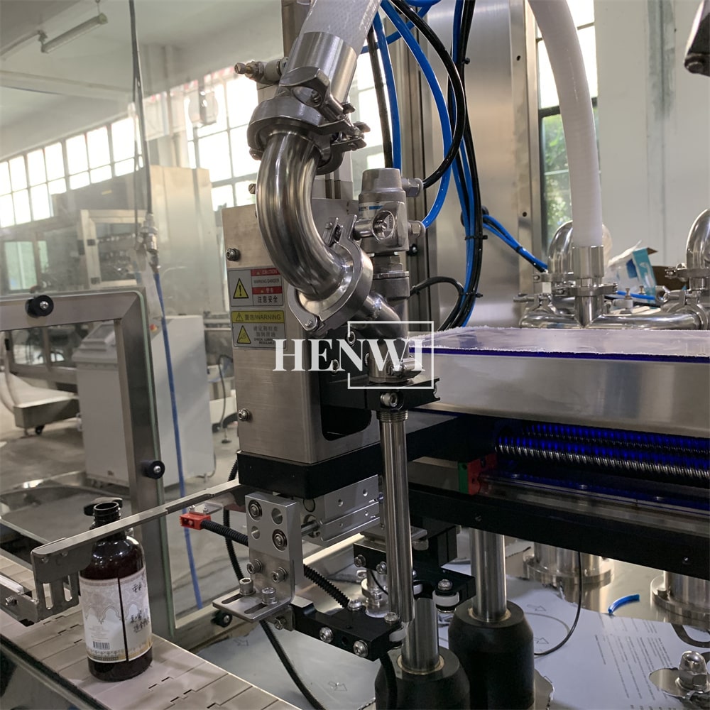 Henwi HWFM-T-2 Two Nozzles Tracking Model Automatic Liquid Bottling Filling Packing Machine 2 Heads Bottle Moving Filler