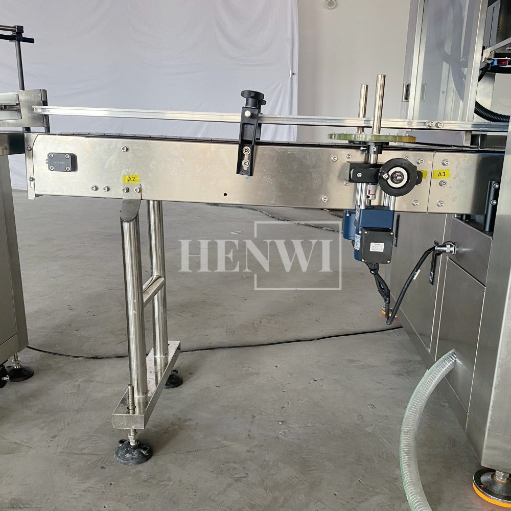 Henwi HWFM-T-4 Four Nozzles Tracking Model Automatic Liquid Bottling Filling Packing Machine 4 Heads Bottle Moving Filler