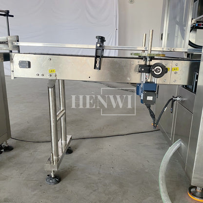 Henwi HWFM-T-4 Four Nozzles Tracking Model Automatic Liquid Bottling Filling Packing Machine 4 Heads Bottle Moving Filler