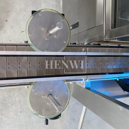 Henwi HWFM-T-4 Four Nozzles Tracking Model Automatic Liquid Bottling Filling Packing Machine 4 Heads Bottle Moving Filler