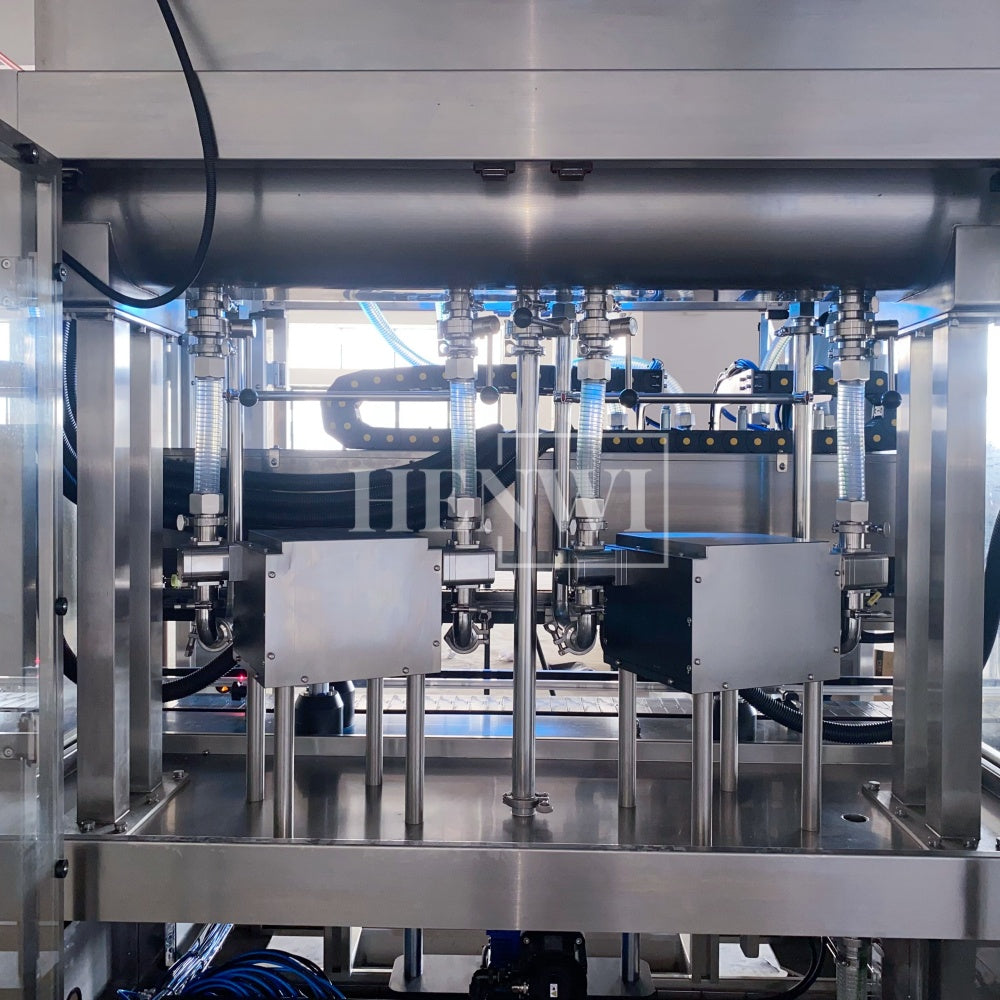 Henwi HWFM-T-4 Four Nozzles Tracking Model Automatic Liquid Bottling Filling Packing Machine 4 Heads Bottle Moving Filler