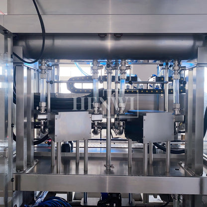 Henwi HWFM-T-4 Four Nozzles Tracking Model Automatic Liquid Bottling Filling Packing Machine 4 Heads Bottle Moving Filler