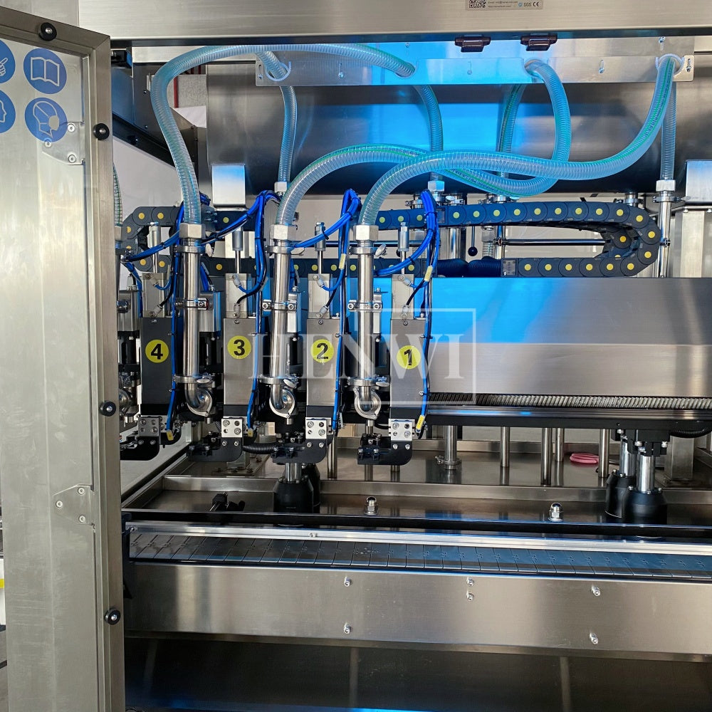 Henwi HWFM-T-4 Four Nozzles Tracking Model Automatic Liquid Bottling Filling Packing Machine 4 Heads Bottle Moving Filler