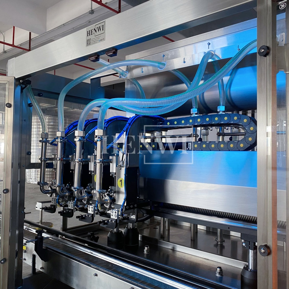 Henwi HWFM-T-4 Four Nozzles Tracking Model Automatic Liquid Bottling Filling Packing Machine 4 Heads Bottle Moving Filler