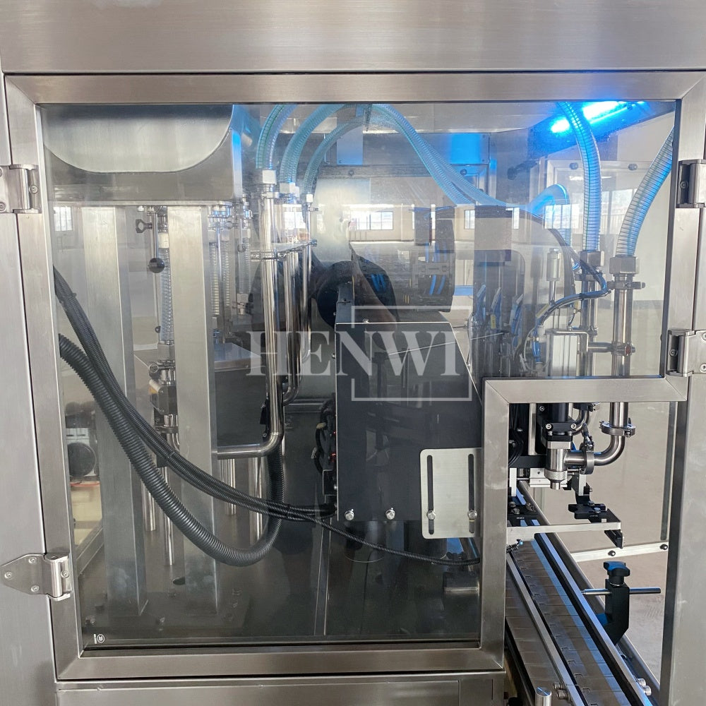 Henwi HWFM-T-4 Four Nozzles Tracking Model Automatic Liquid Bottling Filling Packing Machine 4 Heads Bottle Moving Filler