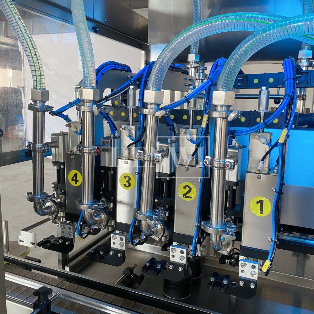 Henwi HWFM-T-4 Four Nozzles Tracking Model Automatic Liquid Bottling Filling Packing Machine 4 Heads Bottle Moving Filler