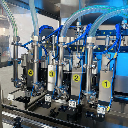 Henwi HWFM-T-4 Four Nozzles Tracking Model Automatic Liquid Bottling Filling Packing Machine 4 Heads Bottle Moving Filler