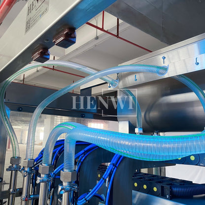 Henwi HWFM-T-4 Four Nozzles Tracking Model Automatic Liquid Bottling Filling Packing Machine 4 Heads Bottle Moving Filler