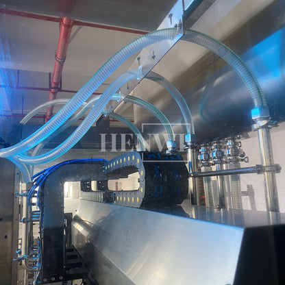Henwi HWFM-T-4 Four Nozzles Tracking Model Automatic Liquid Bottling Filling Packing Machine 4 Heads Bottle Moving Filler