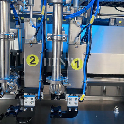 Henwi HWFM-T-4 Four Nozzles Tracking Model Automatic Liquid Bottling Filling Packing Machine 4 Heads Bottle Moving Filler