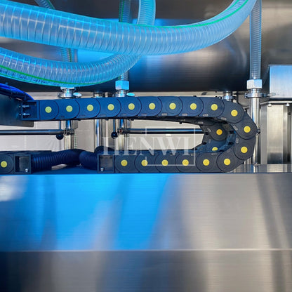 Henwi HWFM-T-4 Four Nozzles Tracking Model Automatic Liquid Bottling Filling Packing Machine 4 Heads Bottle Moving Filler