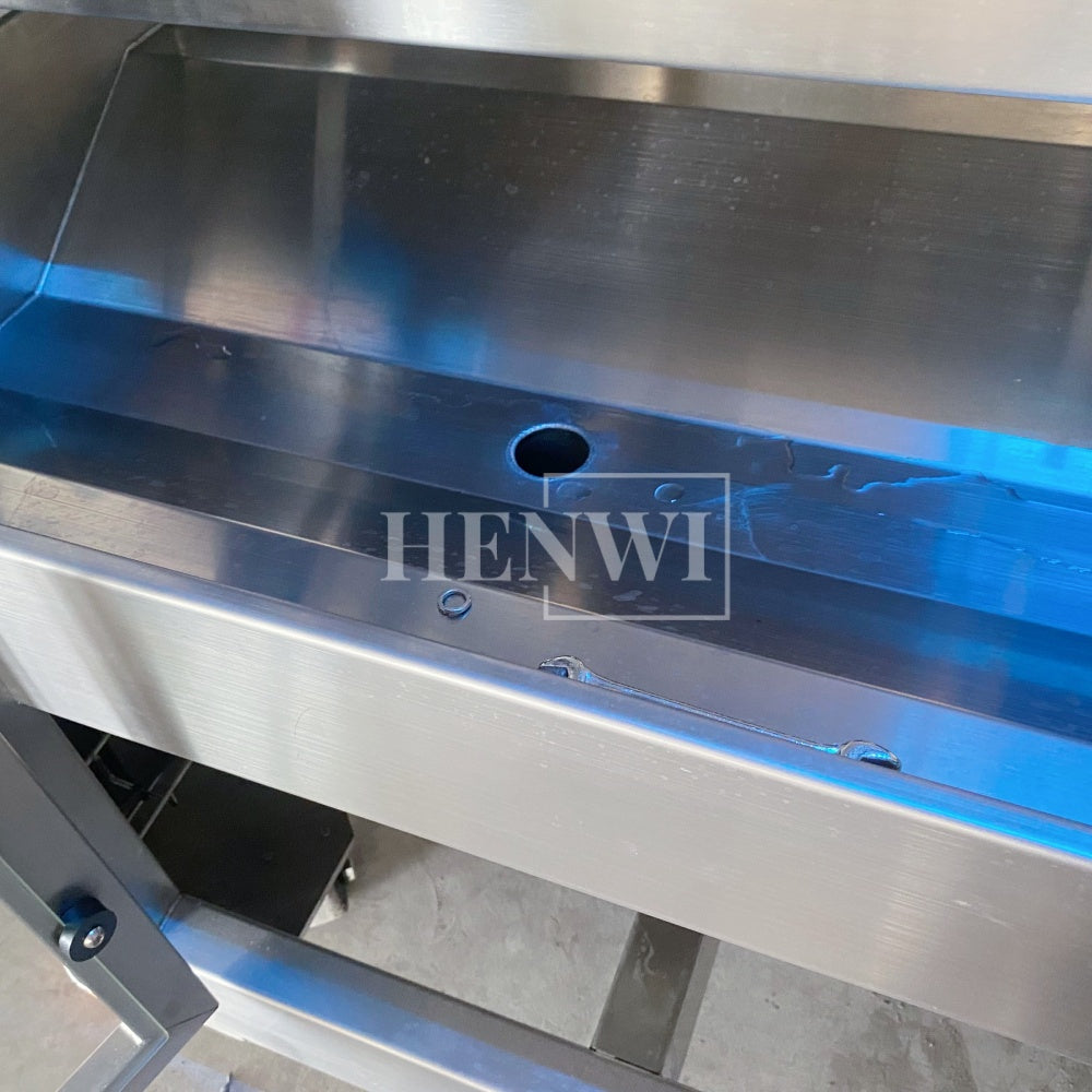 Henwi HWFM-T-4 Four Nozzles Tracking Model Automatic Liquid Bottling Filling Packing Machine 4 Heads Bottle Moving Filler