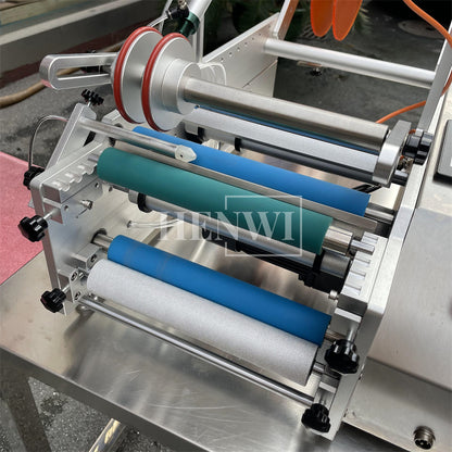 Henwi HWLM-S-HR Semi Auto Horizontal Model Round Bottle Jar Labeller Machine Self-Adhesive Sticker Labeling Machine