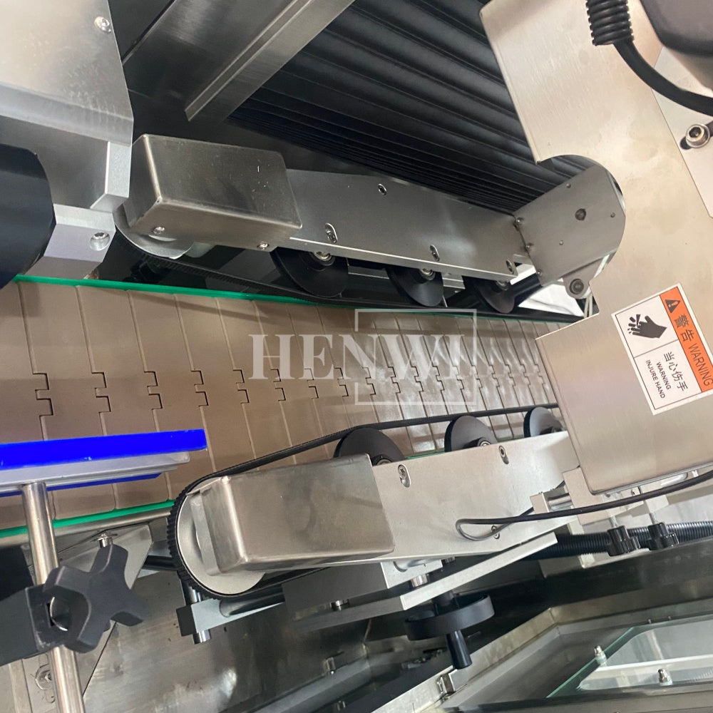 Henwi HWLM-Bottle Sleeve Dropping Wrapping Shrinking Machine Plastic Glass Beer Bottle Jar Pop Can Tin Sleeve Labeling Steam Shrinking Machine