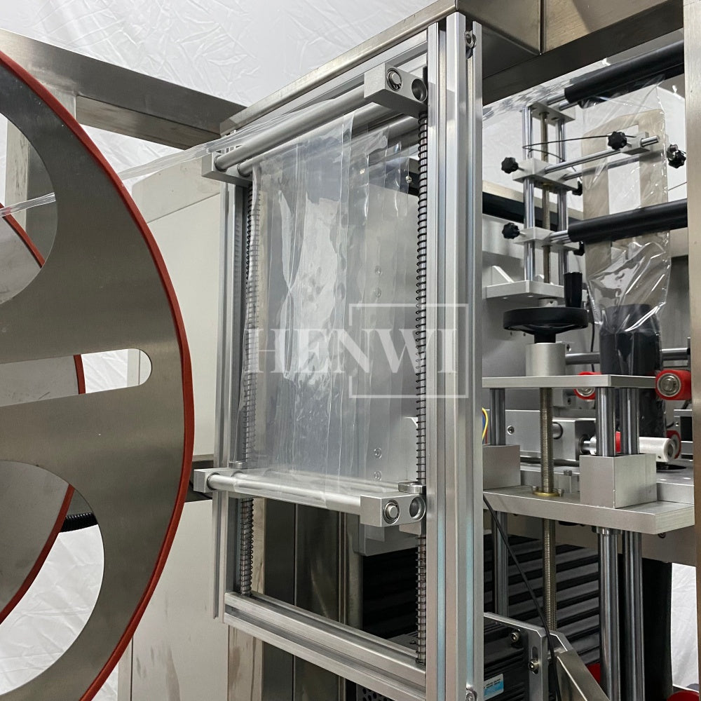 Henwi HWLM-Bottle Sleeve Dropping Wrapping Shrinking Machine Plastic Glass Beer Bottle Jar Pop Can Tin Sleeve Labeling Steam Shrinking Machine