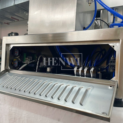 Henwi HWFM-S-VF1 Полуавтоматическая машина для розлива и упаковки жидкостей с одной насадкой Вертикальный наполнитель для бутылок с 1 головкой