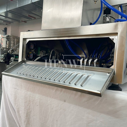 Henwi HWFM-S-VF1 Полуавтоматическая машина для розлива и упаковки жидкостей с одной насадкой Вертикальный наполнитель для бутылок с 1 головкой